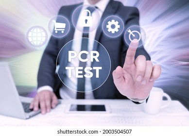 Conceptual Caption Pcr Test. Word For Qualitative Detection Of Viral Genome Within The Short Seqeunce Of DNA Bussiness Man Sitting Desk Laptop And Phone Pointing Futuristic Technology.