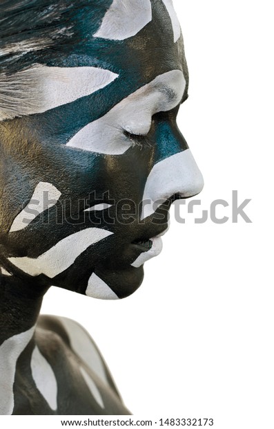Conceptual creative makeup. Black and gray\
stains on women skin. Bold body art\
painting.