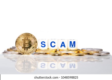 Conceptual Cryptocurrency Bitcoin With The Word Scam On White Background