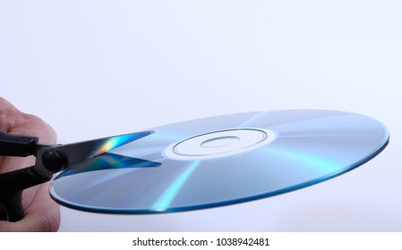 Conceptual Destruction Of The Data On A CD With Scissors