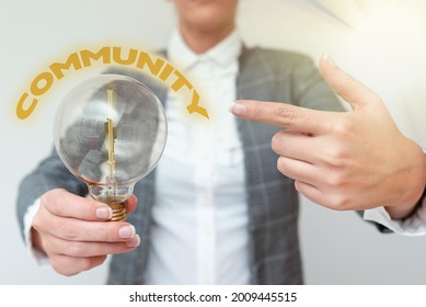 Conceptual display Community. Conceptual photo group of showing with a common characteristics living together Lady in outfit pointing lamp with two hands presenting new technology ideas