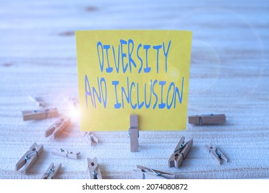 Conceptual display Diversity And Inclusion. Conceptual photo range human difference includes race ethnicity gender Piece Of Blank Square Note Surrounded By Laundry Clips Showing New Idea.