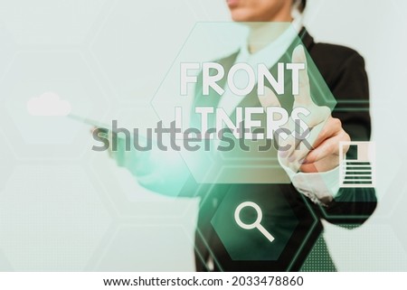 Conceptual display Frontliners. Internet Concept most important or influential position in a debate or movement. Woman In Suit Holding Tablet Showing Futuristic Interface Display.