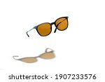 Conceptual elegant Sunglasses hovering isolated on white background. Sun glasses summer accessories as design element for promo or advertising banner. High quality photoSunglasses hovering on white