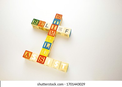 Conceptual Government Economic Stimulus Packages In Financial Relief And Assistance During Crisis Or Covid-19. Top View Wooden Letter Block. Selective Focus On Texts.