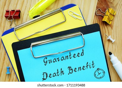 Conceptual Hand Writing Showing Guaranteed Death Benefit.