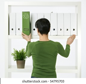 Conceptual Image Of Environmental Conservation, Woman Working In Green Office.