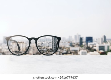 Conceptual image of glasses focusing on urban landscape, clarity in vision and perception - Powered by Shutterstock