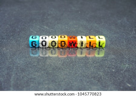 Conceptual image of goodwill as intangible assets in business. Texts on colorful alphabet beads on reflective dark surface. focus on selective beads closer to foreground; other in gradient blur.