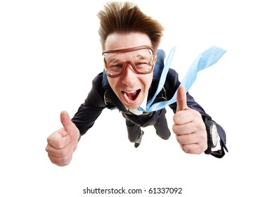 Conceptual image of happy man flying with parachute and showing thumbs up