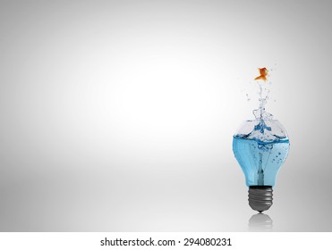 Conceptual image with light bulb filled with clear water