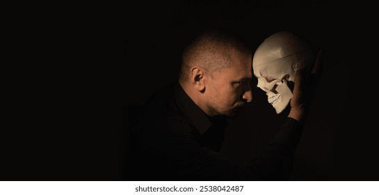 Conceptual image: Man with skull. Death is the end of our whole game called life. Copy space for text or design. - Powered by Shutterstock