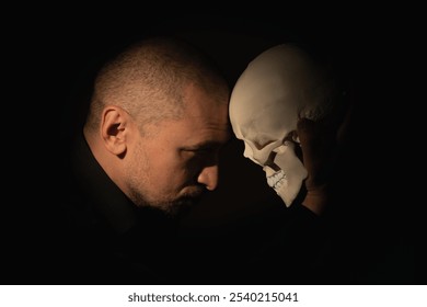 Conceptual image: Man with skull. Death is the end of our whole game called life - Powered by Shutterstock