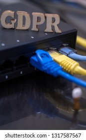 Conceptual Image Of Miniature People  With Ethernet Cables And GDPR Wooden Text. Selective Focus.