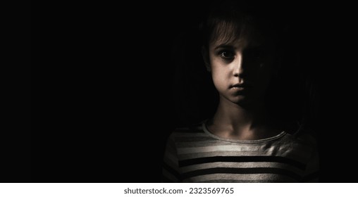 Conceptual image: psychological injuries, children's anxieties and fears, lost childhood. Sad unhappy little child girl feel lonely abandoned, children drama. Copy space for text or design. - Shutterstock ID 2323569765