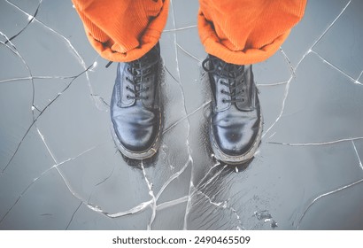 Conceptual Image Of Thin Ice Cracking Underneath Someone's Feet