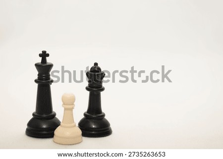Conceptual image using chess pieces to represent social inequality, diversity, inclusion and power imbalance. Symbolic metaphor for leadership, discrimination, minority versus majority, social pressure and equality. Ideal for business, education, social campaigns, editorial content and awareness projects.