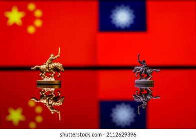 Conceptual image of war between China and Taiwan using toy soldiers and national flags on a reflective background - Powered by Shutterstock