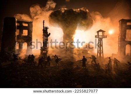 Conceptual image of war between Democracy and dictatorship using toy soldiers. Battle in ruined city. Selective focus