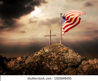 Conceptual image of waving American flag at tall pole and wooden cross over sunset sky