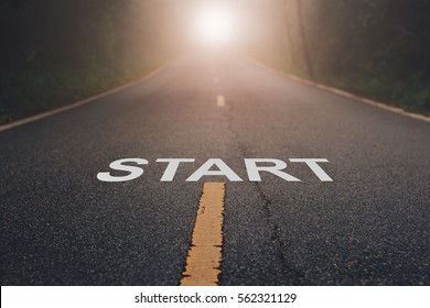 Conceptual image with word start on asphalt road   / Start Your Life
