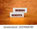 Conceptual member benefits symbol. Copy space. MEMBER BENEFITS message written, It is made up of vertical blocks on an abstract background