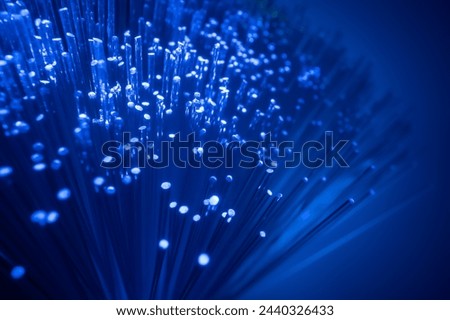 Conceptual multicolored image with short focal length fiber optic network cable for fast communication. macro.