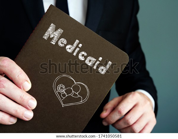 Conceptual\
photo about Medicaid with handwritten\
phrase.