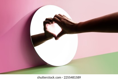 Conceptual Photo for Love and Relationship. Love Yourself. Single Person using Hand to Form a Heart Shape on the Mirror. Fill Yourself with Romance on Valentines Day - Shutterstock ID 2255481589