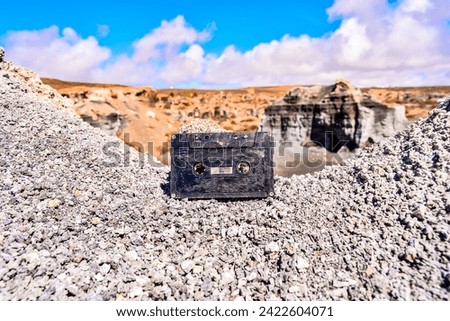Conceptual Photo Picture of a Music Tape Cassette Object in the Dry Desert