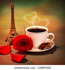 Conceptual Photo Of Romantic Trip To France, Beautiful Morning In Paris, Food Still Life, Cup Of Coffee With Piece Of Chocolate And Fresh Red Rose On The Table In Cafe, Honeymoon Travel, Valentine Day