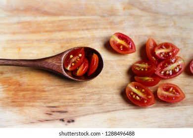 Conceptual Photo Of Sliced Cherry Tomatoes On A Wooden Spoon To Convey Concept Of Healthy Choice, Zero Waste, Organic Choice And Plant- Based Diet 