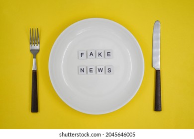 Conceptual Photo, Table Setting With An Empty Plate, Fake News Consumption By The Public Or Consumers- 