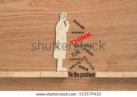 Conceptual of problem solving, overcoming challenges and using ideas, solution showing problems solving using brain by thinking and creativity. Wooden blocks and businessman