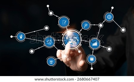 A conceptual representation of digital technology showcasing an interactive hand touching data analysis icons within an information network on a dark background. Tessel