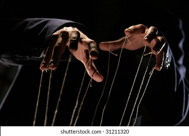 Conceptual Series: Hands Of Puppeteer With Rope