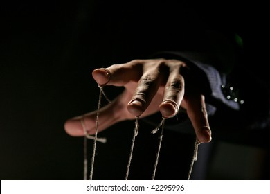 Conceptual Series: Hands Of Puppeteer With Rope