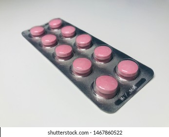 Conceptual Shot Of Red Vitamin Medication Tablets Made Of Baht Heaven Compositions On White Background Buying Medicine Health Living B12 Vitamins. 