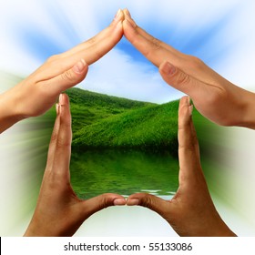 Conceptual Symbol Home Made By Black And White People Hands Framing The Nature Scenery