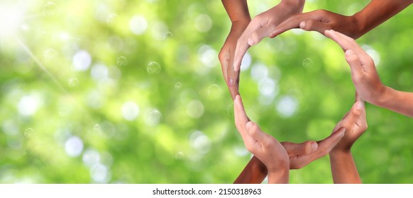 Conceptual Symbol Of Multiracial Human Hands Making A Circle On  Nature Background With A Copy Space In The Middle. Conceptualization, Hands-on For Business And Service, Volunteering Or Teamwork, 