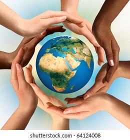 Conceptual symbol of multiracial human hands surrounding the Earth globe. Unity, world peace, humanity concept.