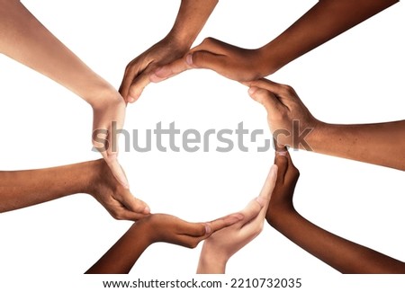 Conceptual symbol of multiracial human hands making a circle on white background with a copy space in the middle. The concept of unity, cooperation, partnership, teamwork and charity.