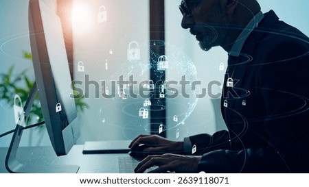 Conceptual visual of network security with a man working in an office
