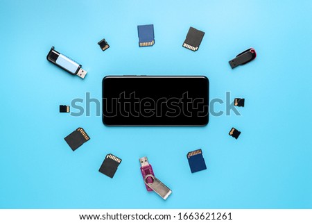 Conceptual World Backup Day background,data base safety, storage device, black smartphone with space for text