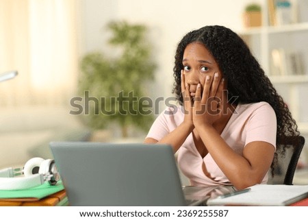 Concerned black student e-learning looking at you complaining at home