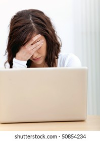 Concerned Business Woman With A Laptop At The Office