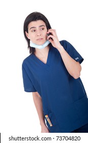 Concerned Female Doctor In Uniform Talking On The Phone (isolated On White Background)