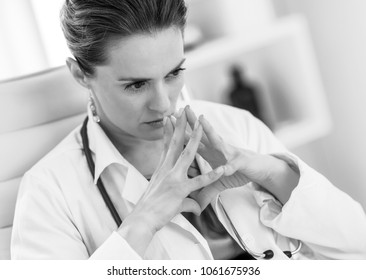 Concerned Medical Doctor Woman In Office