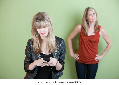 Concerned Mom Watches Teen Send Text Messages On Phone