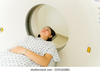 Concerned Sick Woman Patient Getting A Medical Test And Checking For Cancer With A CAT Scan At The Medical Imaging Lab